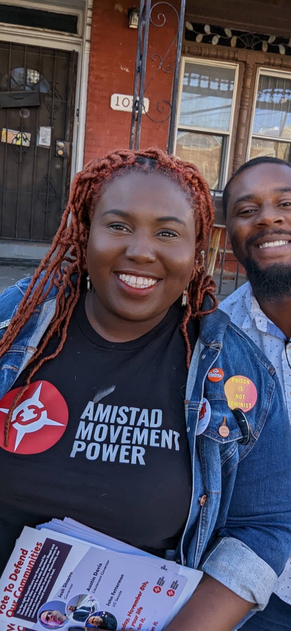 kris, nikki and derrick of AMP pose for a photo while canvassing