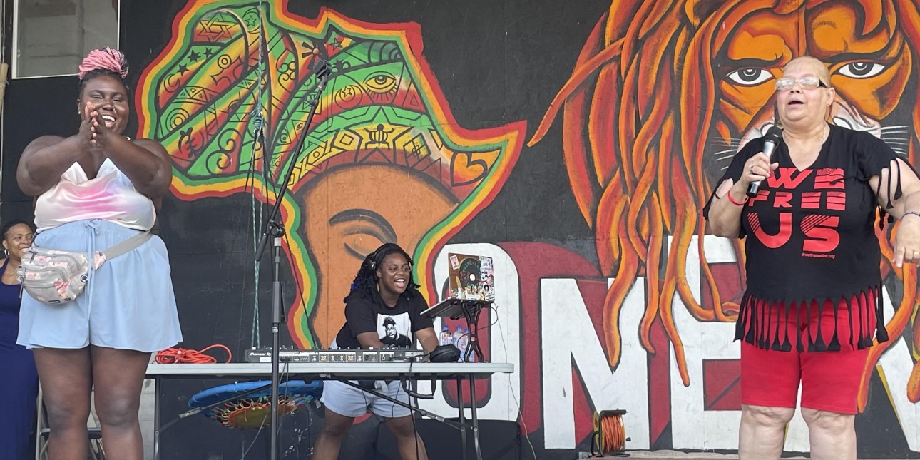 Nikki points her fingers toward the crowd and Mrs Dee Dee takes to the mic as DJ Ansharaye spins behind them