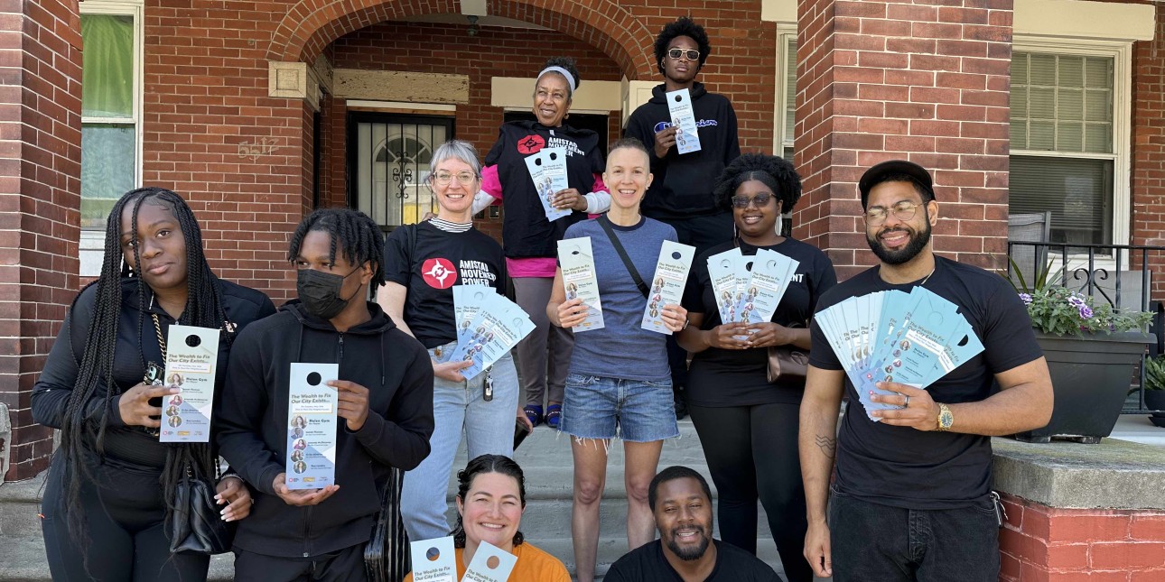 a group of AMP canvassers gather on a porch 