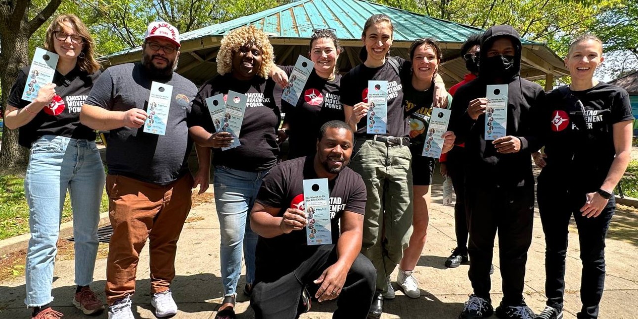 canvassers stand shoulder to shoulder with election material