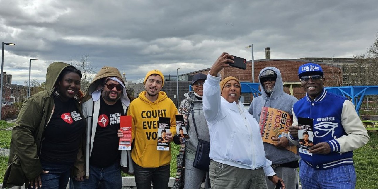 Volunteers with Amistad Power, Free The Ballot, Straight Ahead, and Reclaim pose for photo before canvassing