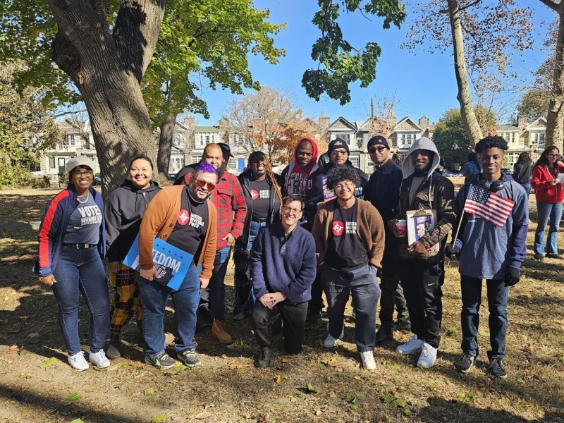 A group of canvassers huddle together