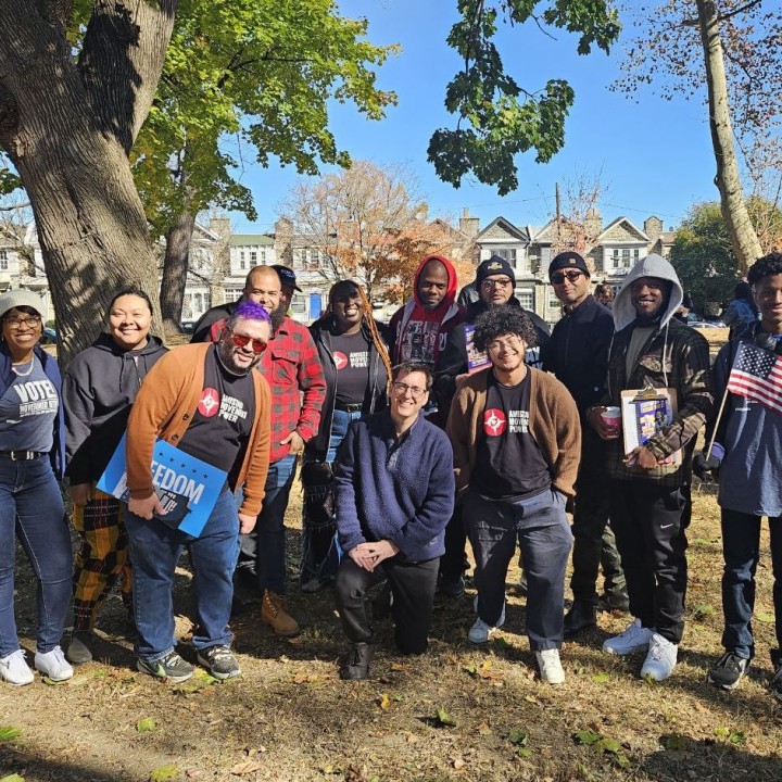 A group of canvassers huddle together